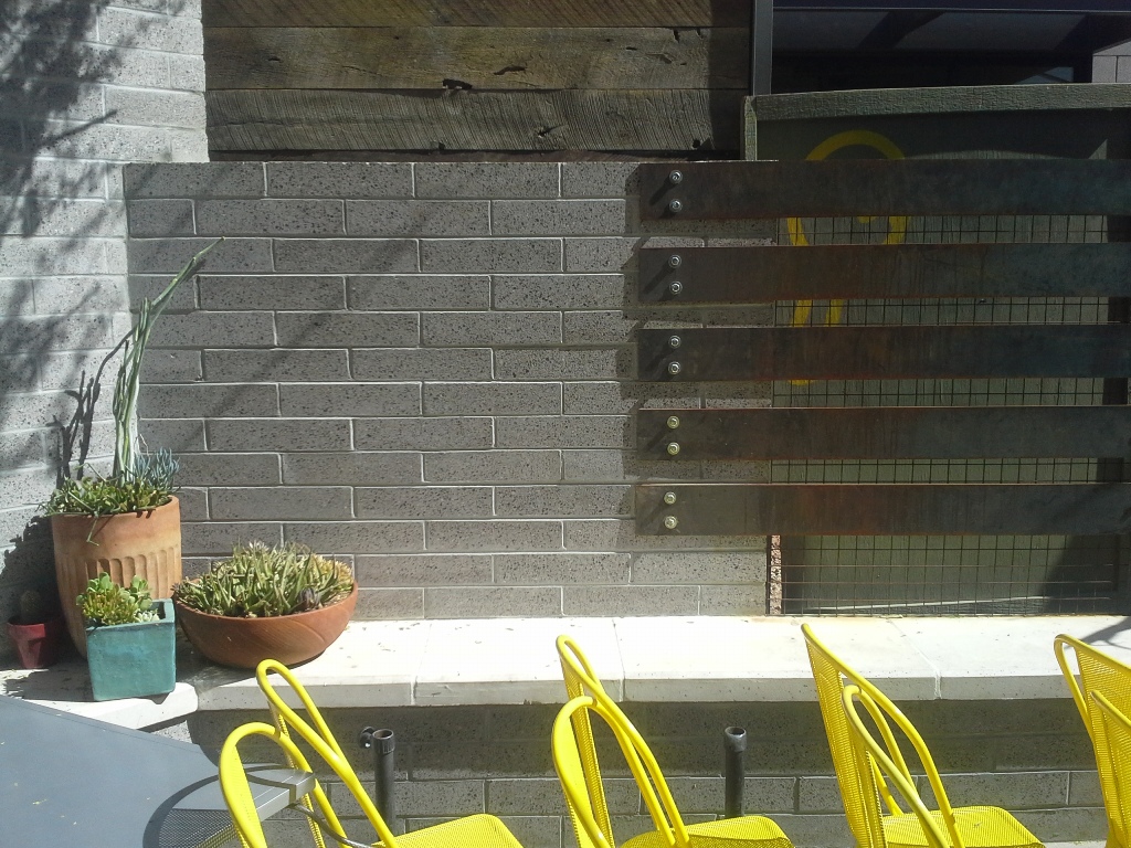Exterior hardscape design | Fireplace Hearth in Restaurant Entertainment Area Outside | Joyride Taco Place